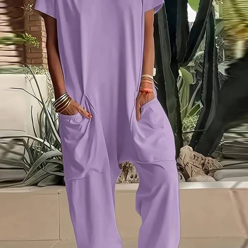a womens loose fitting romper with pockets in a single color