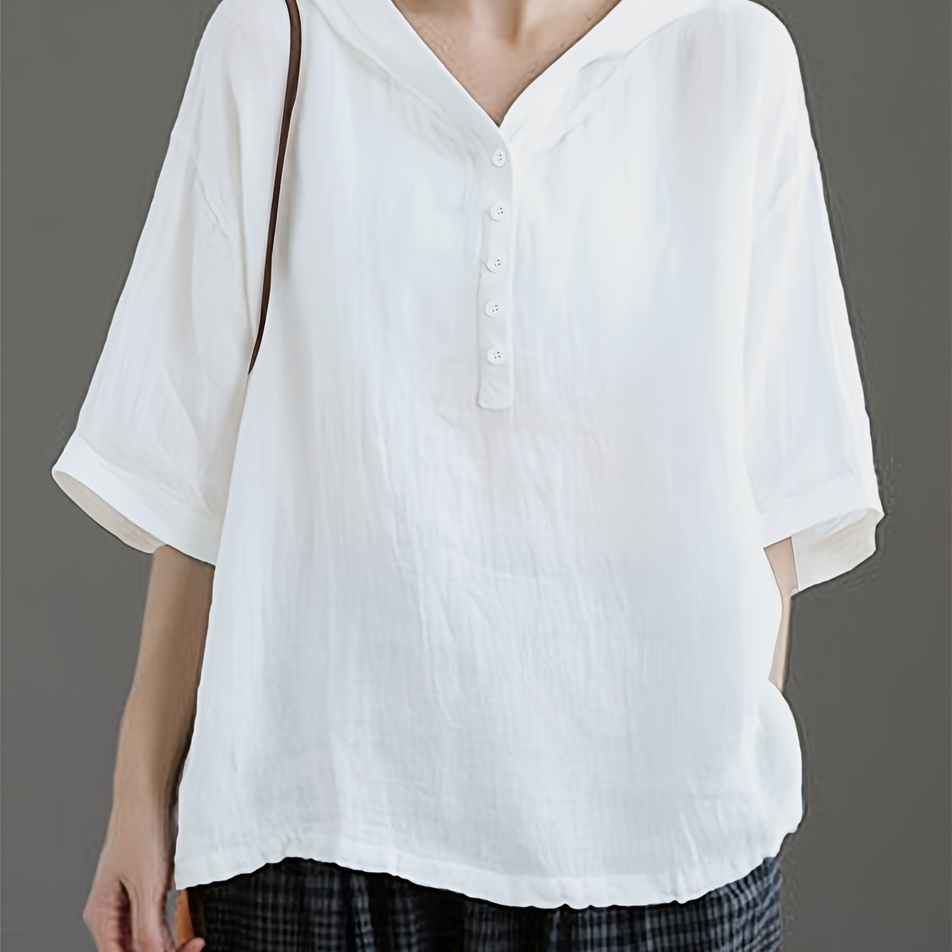 Image of Women's Loose Fit Hooded Blouse With Front Button Detail - Solid Color White, Half Sleeve, Breathable, For Casual Attire, Apparel, Hooded Neckline, Semitransparent Material