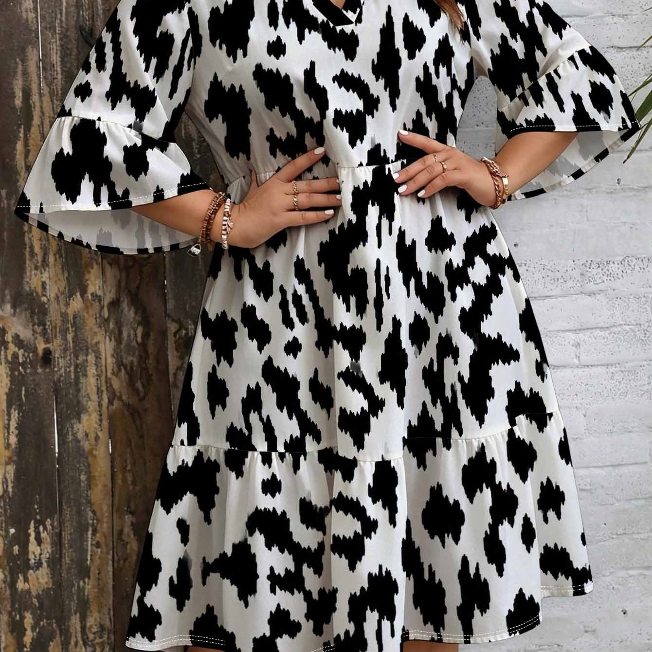 Image of Plus Size Animal Print Dress For Women. V-neck Notch Collar. Bell Sleeves. Layered Skirt. Loose Fit Monochrome Elegant Bohemian And Vintage Style Midi Dress