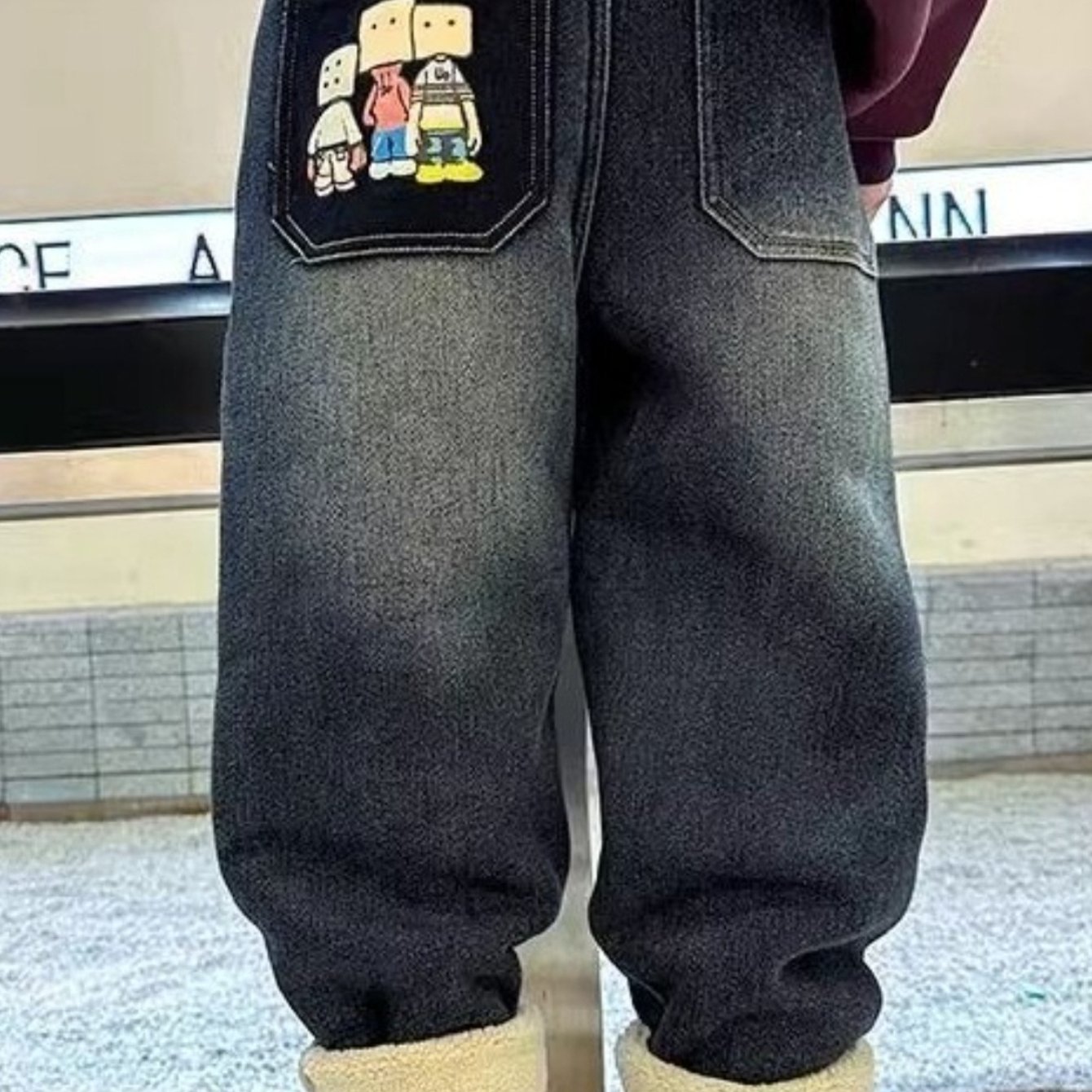 Image of Boys' Winter-weight Sherpa-lined Denim Jeans - Featuring A Cartoon Block-figure Print On The Back Pocket; Vintage-style Distressed Wash With Soft Denim Fabric