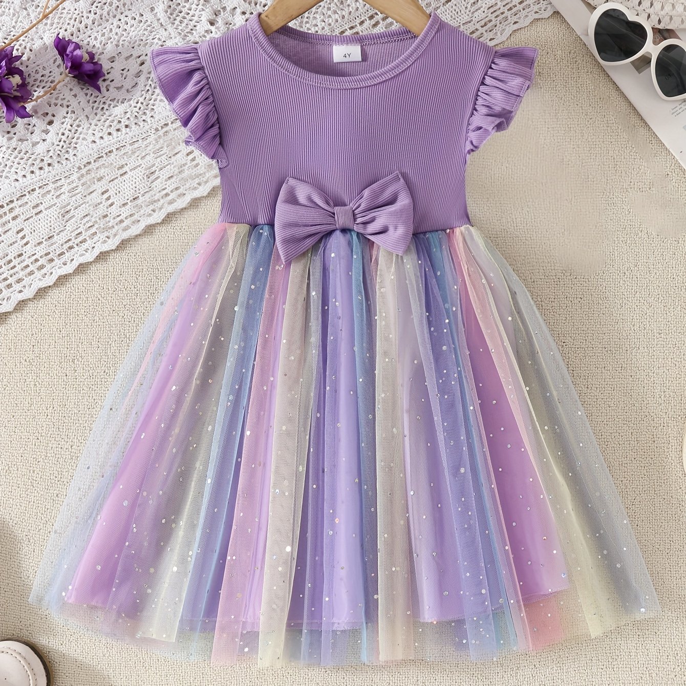 Image of A Cute Casual Dress For Girls Featuring A Purple Striped Bodice With Rainbow Sequins, Mesh Fabric, Lace Sleeves, And A Bow.