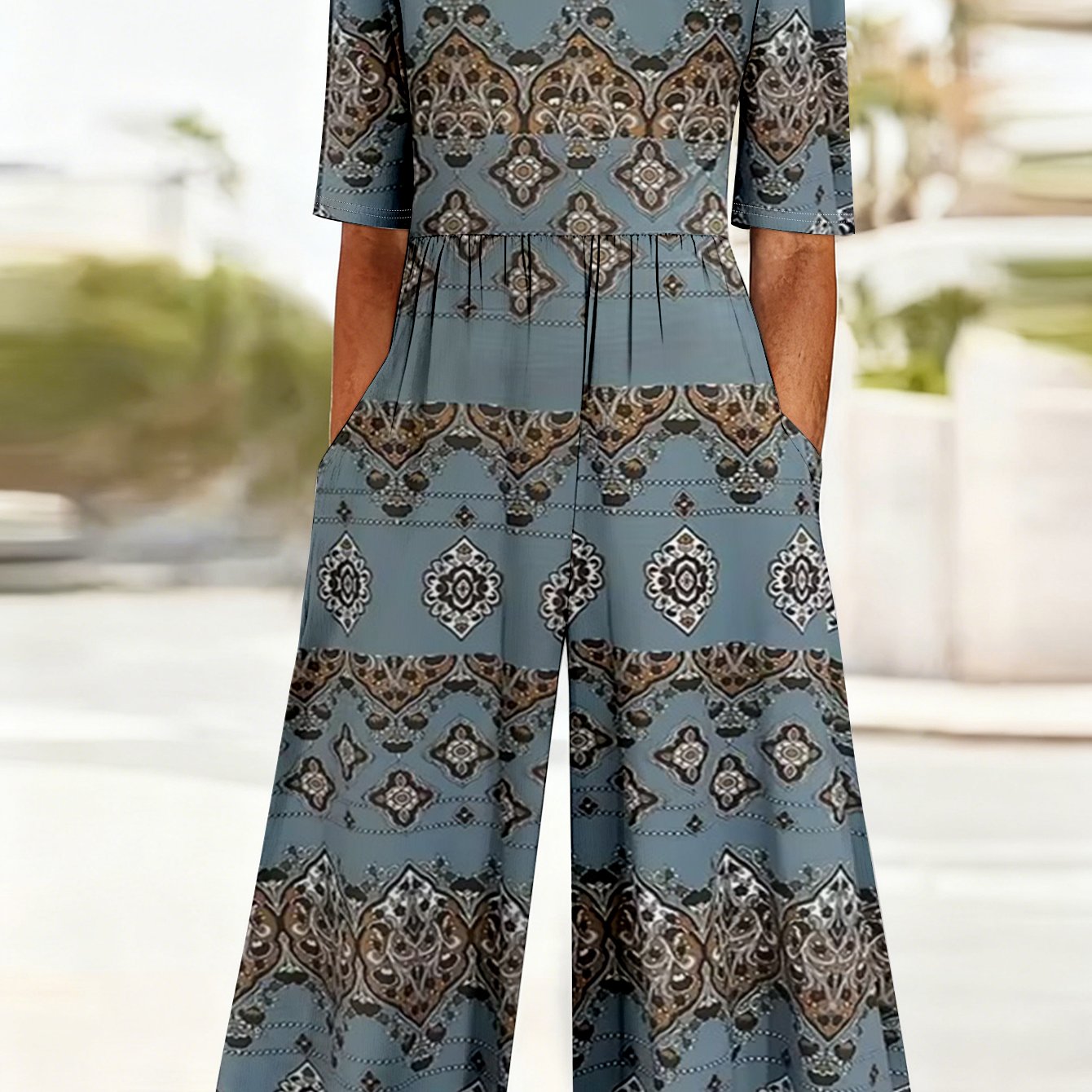 Image of Plus Size - Plus Size - -size Jumpsuit Is Perfect For Vacations, Featuring A Grey-blue Ethnic Geometric Print, Short Sleeves, A V-neck, And A Wide-leg Design That The Waist. Ideal For Travel And