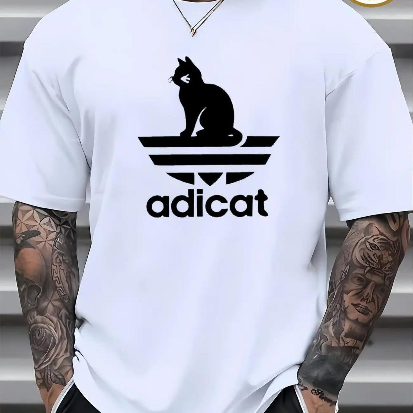 Image of Adicat Parody T-shirt | Black Cartoon Graphic With Adicat Text, Casual Crew Neck Short Sleeve Tee For , , Perfect For Adults, Regular Fit, Stretch Fabric, Print Pattern