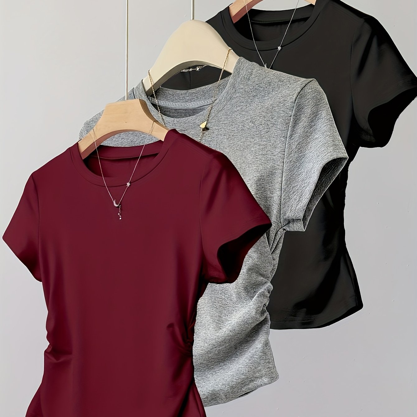 E-shop Lässiges Sportmode Rundhals Kurzarm T-Shirt in Unifarben für Damen mit Taillenbetonung und Design-fokussiertem Style