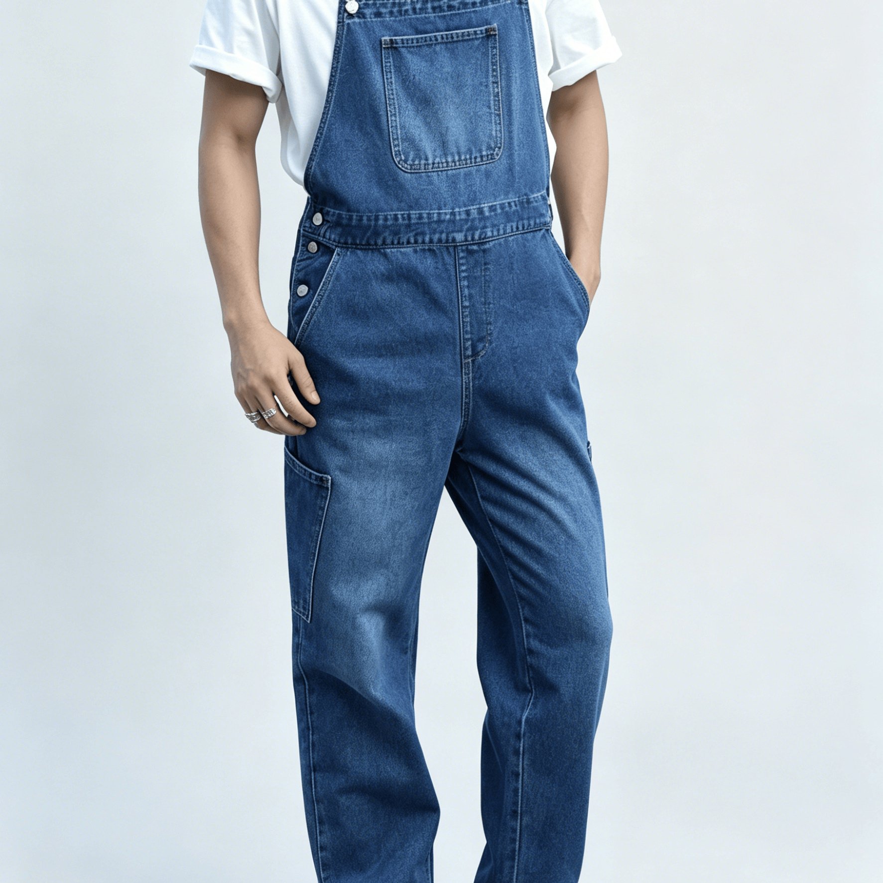 Image of Washed Blue Workwear Denim Overalls: Loose-fit, Straight-leg, Retro-style Casual Overalls With Side Patch Pockets And Adjustable Shoulder Straps. A Versatile Style That Pairs Well With Any Outfit.