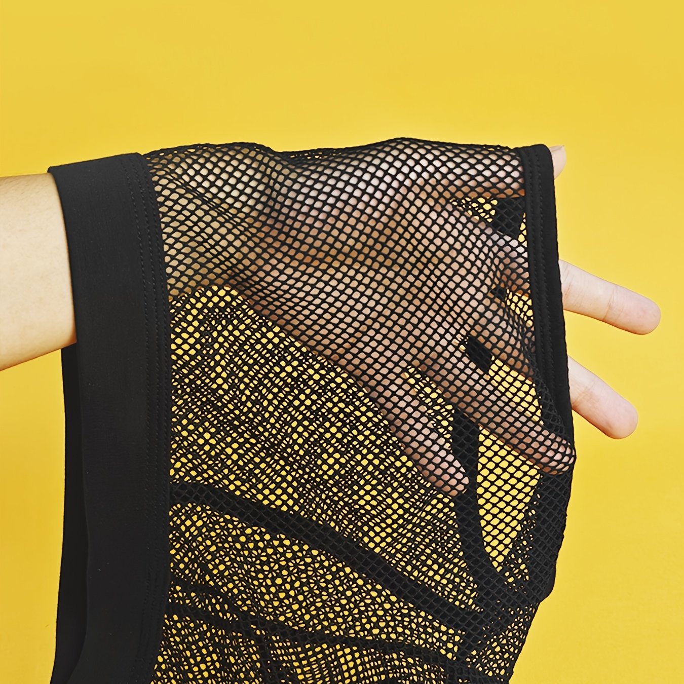 Image of Men's Breathable Mesh Boxer Shorts With Elastic Fabric, Perfect For Nightlife And Parties, Featuring Transparent And Hollow Designs.