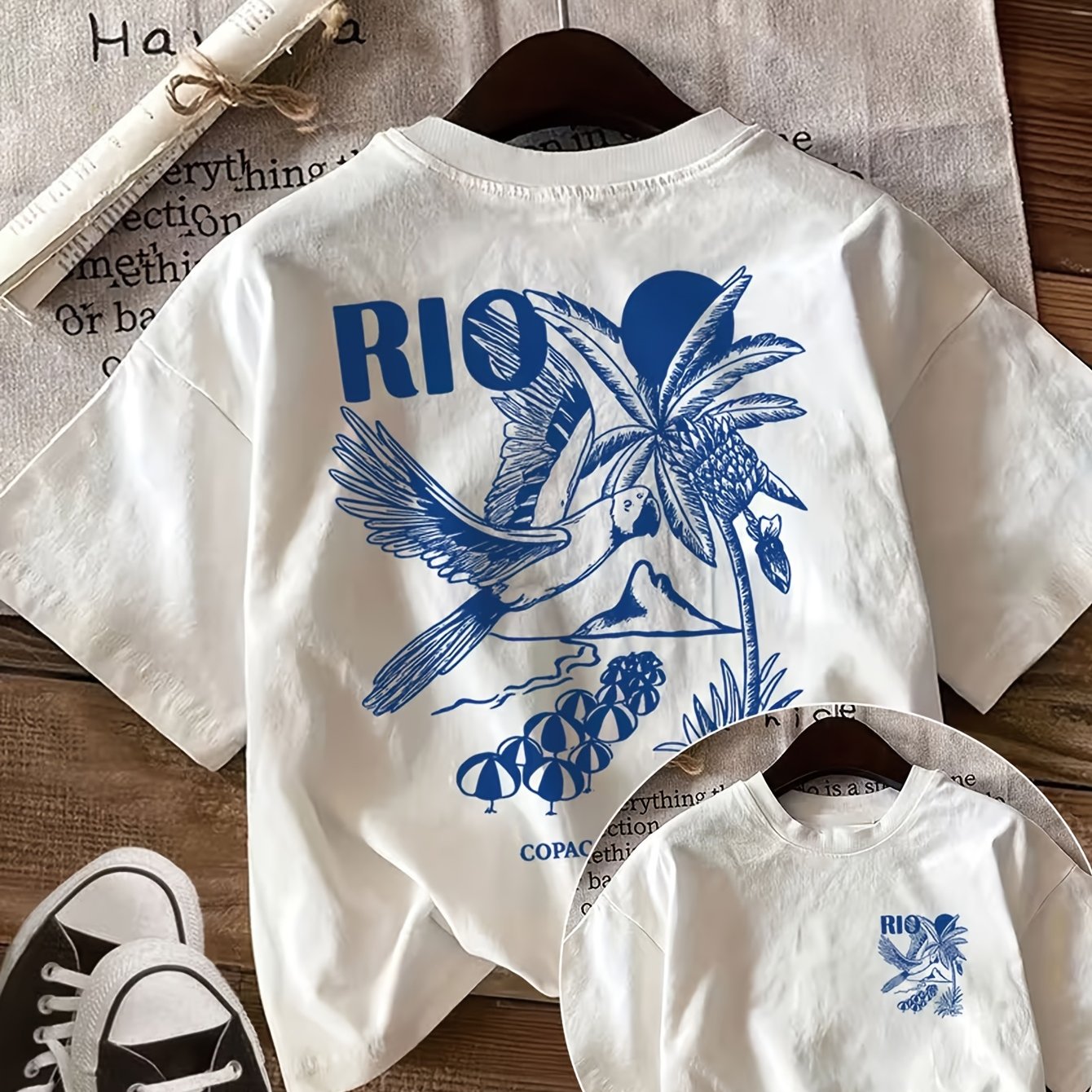 TEMU Haut décontracté d'été pour femme avec un imprimé de style vintage. Le motif des de perroquet et de palmier, avec une « RIO COPACABANA » sur un