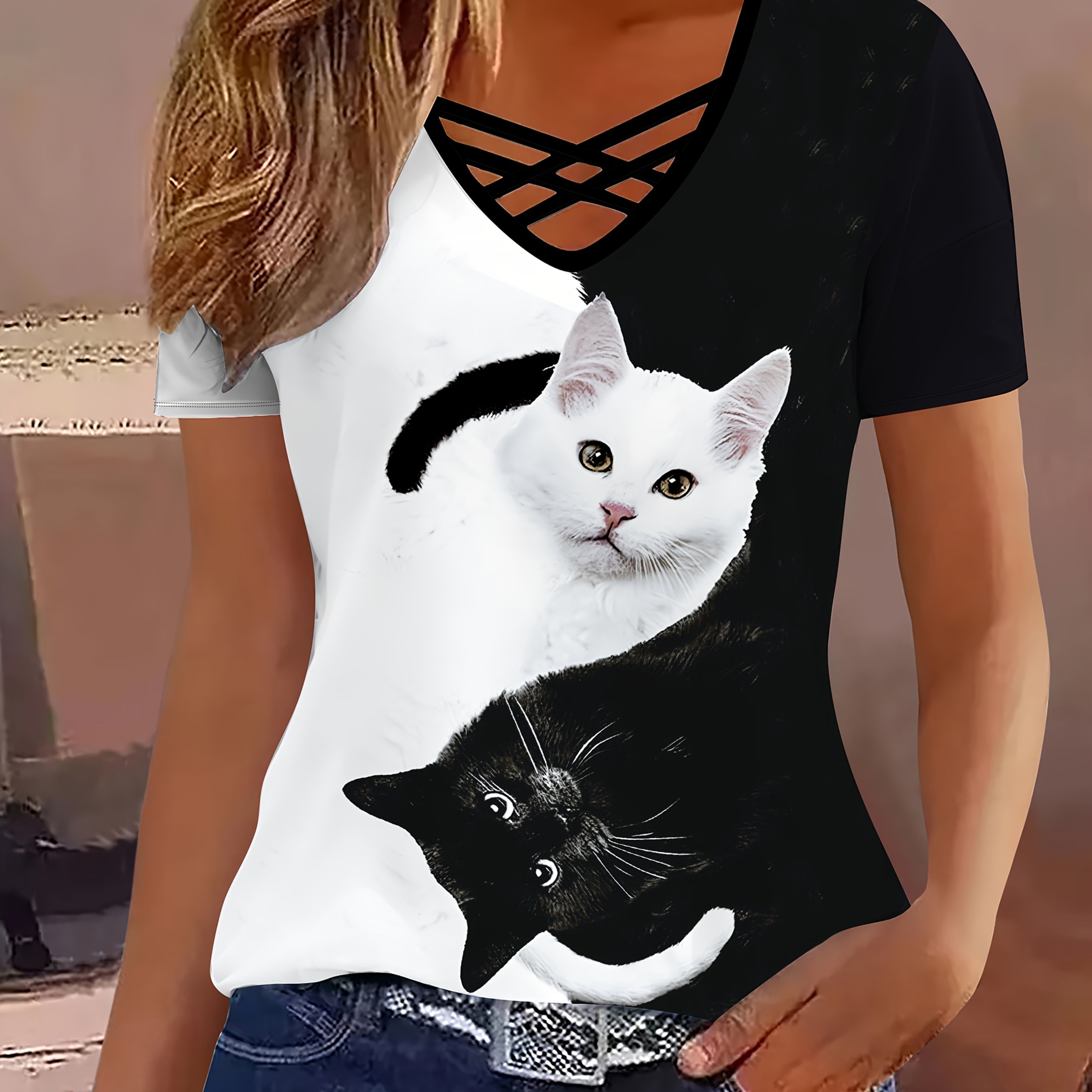Image of Elegant Women's Black And White Cat Print Short-sleeve T-shirt With A Trendy V-neck And Cross Straps