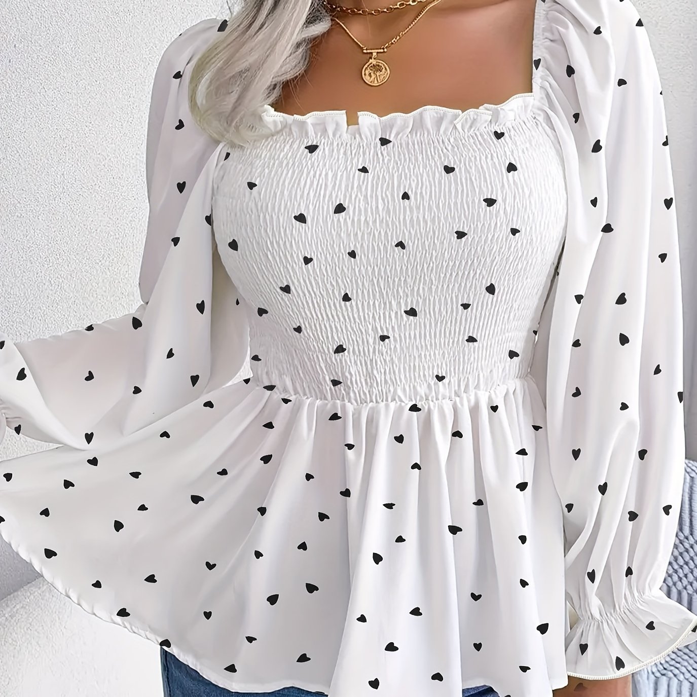 A Long-sleeved Top With Neckline That Cinches At The Waist And The Bust